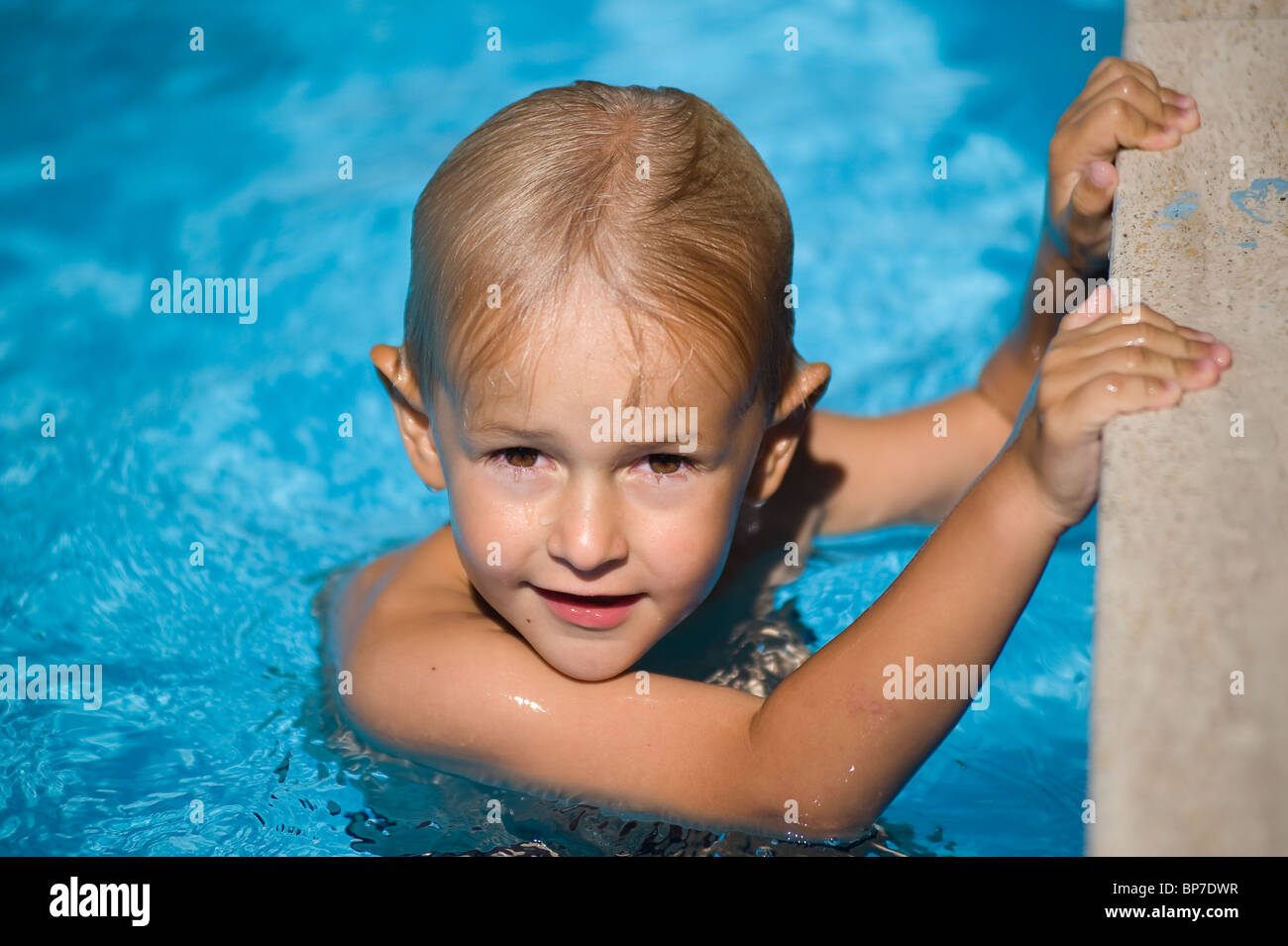 Boy in the swimming pool Stock Photo Alamy
