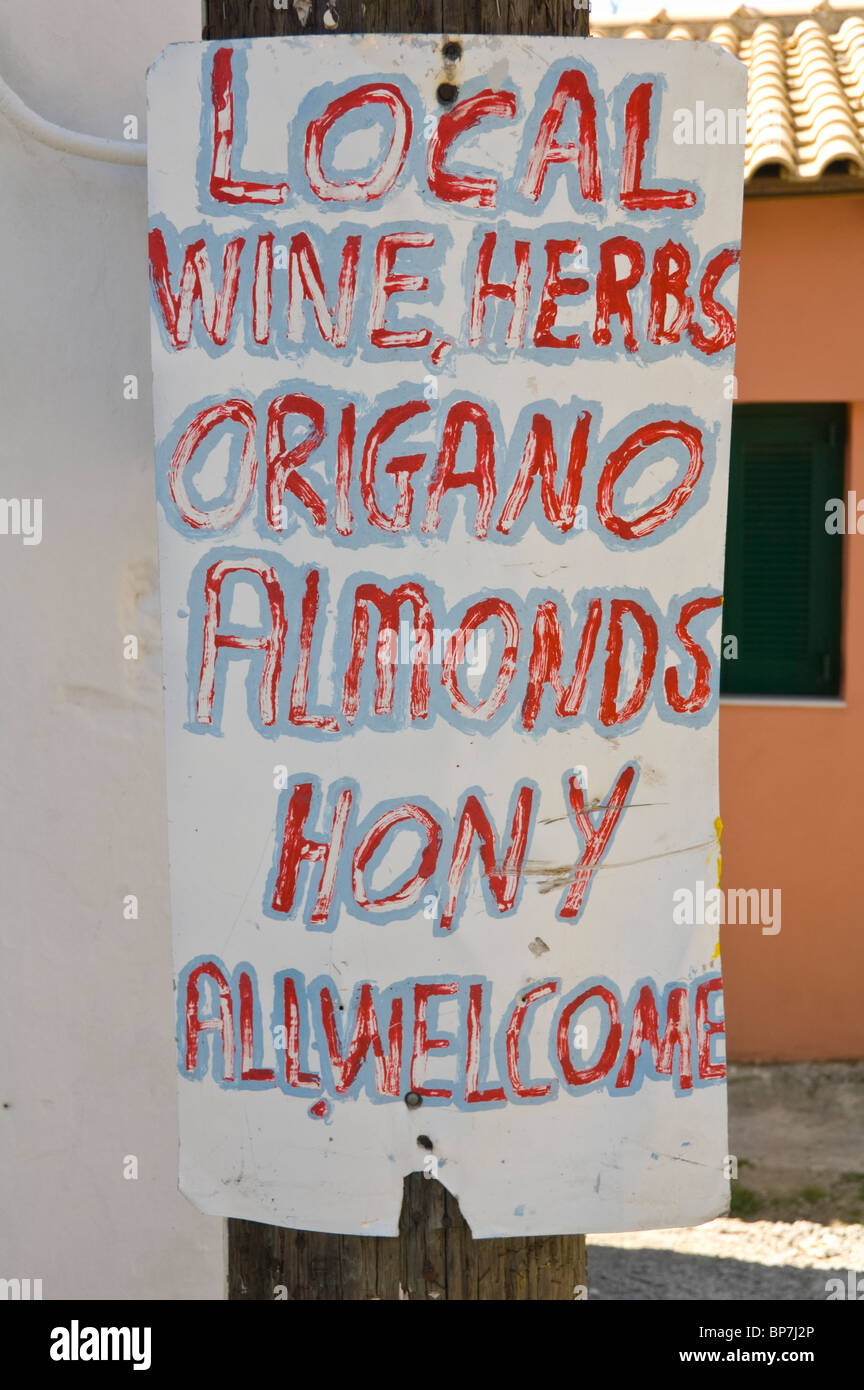 Rustic homemade sign outside grocery shop in mountain village of Makrades on the Greek Mediterranean island of Corfu Greece GR Stock Photo