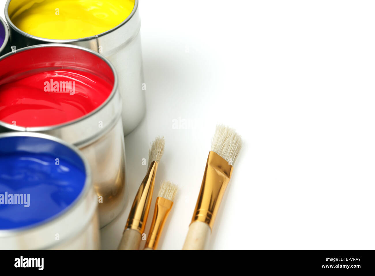 Cans of paint with paintbrushes Stock Photo