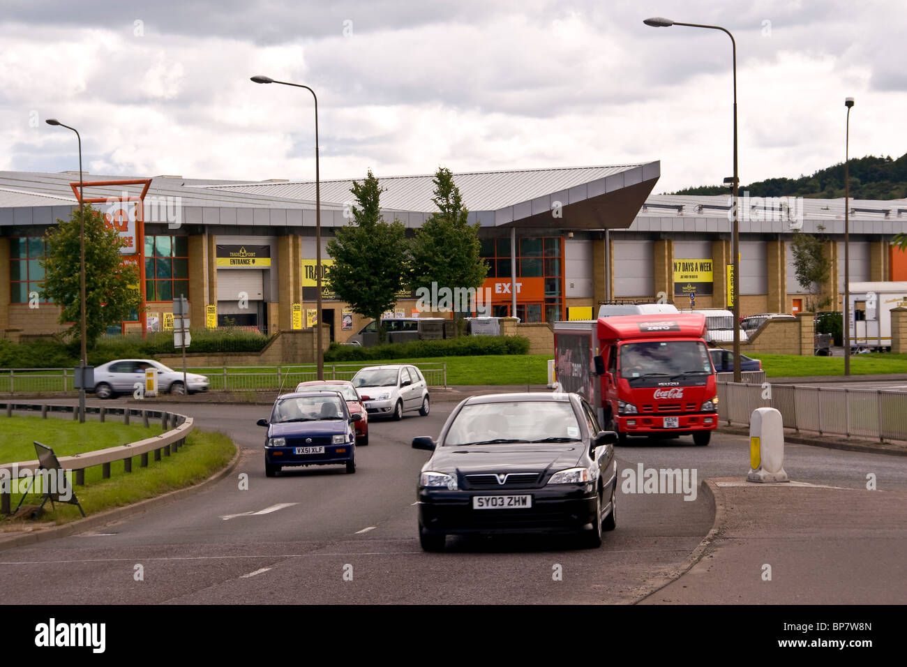 Vehicles travelling around a busy roundabout near B&Q warehouse along Kingsway West Industrial Estate in Dundee, UK Stock Photo