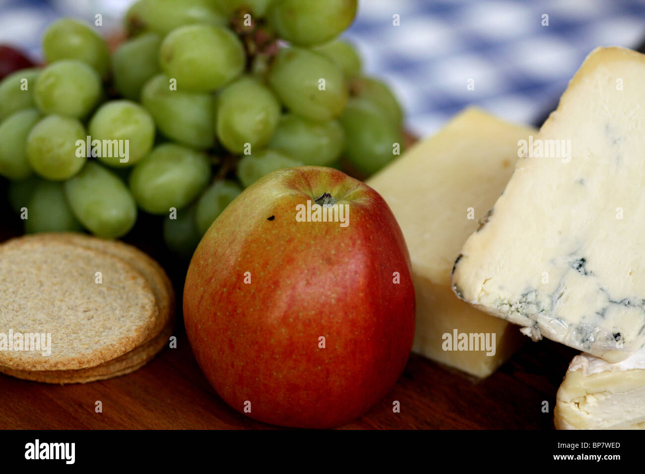 ploughman's lunch, oatcakes, grapes, cheese and apple Stock Photo