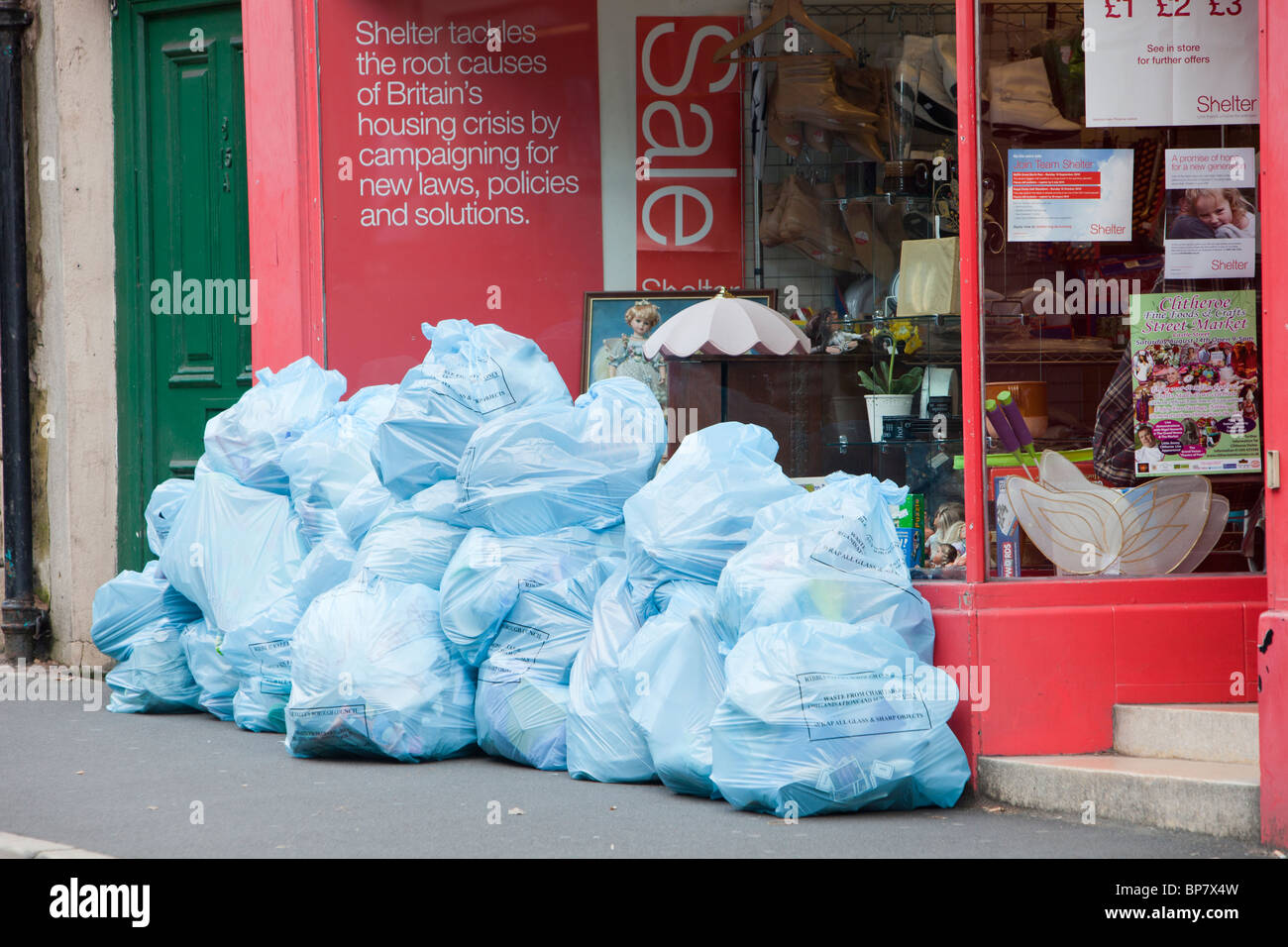 Trade waste bags outside a charity shop in Clitheroe, Lancashire, UK