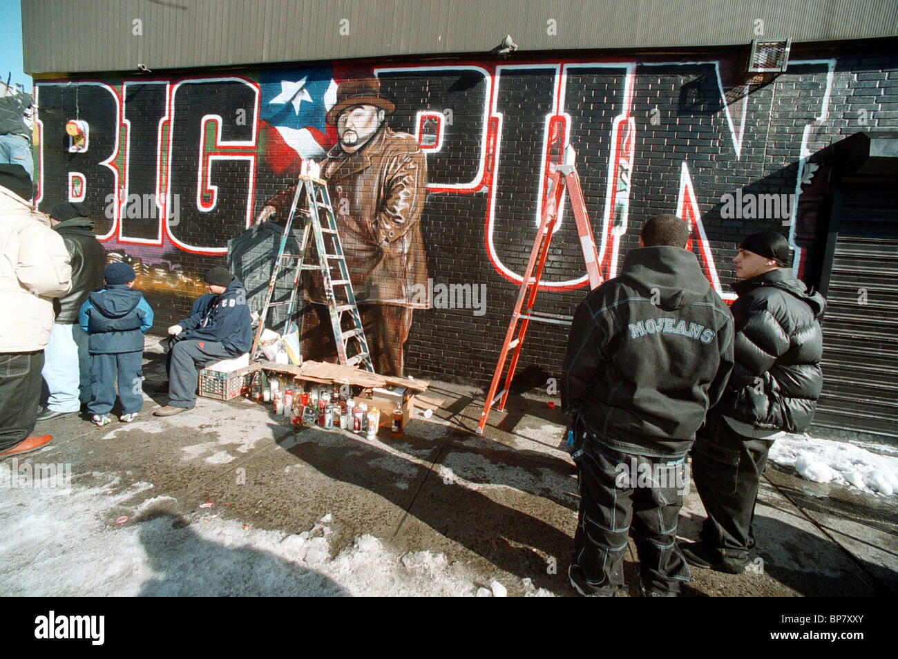 Fans of Big Pun congregate around a mural painted by 'Tats Cru Inc' in memory of the rapper Stock Photo