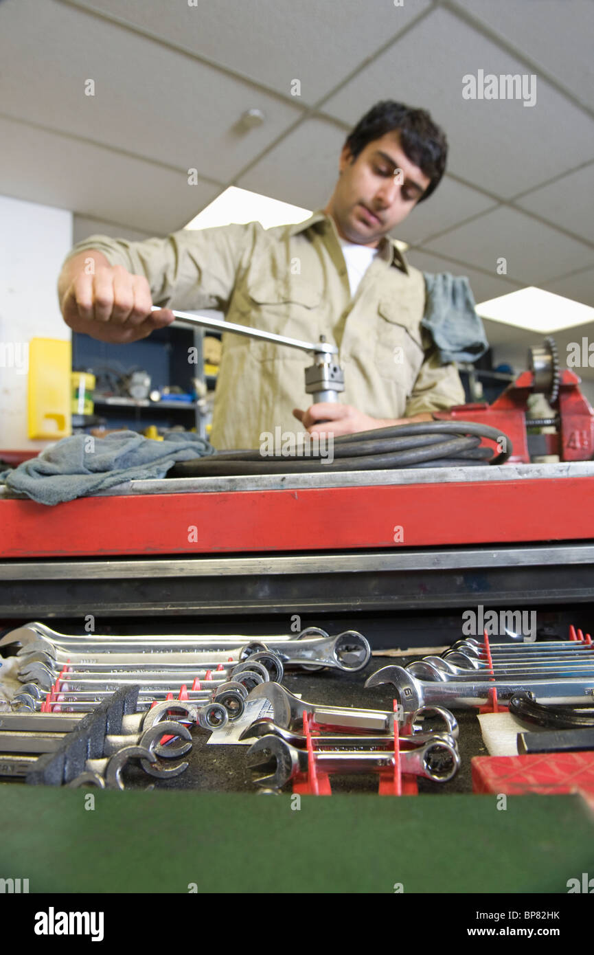 Man in workshop with tools Stock Photo - Alamy