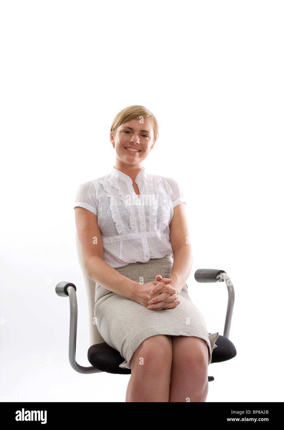 Young woman sitting in office chair Stock Photo Alamy