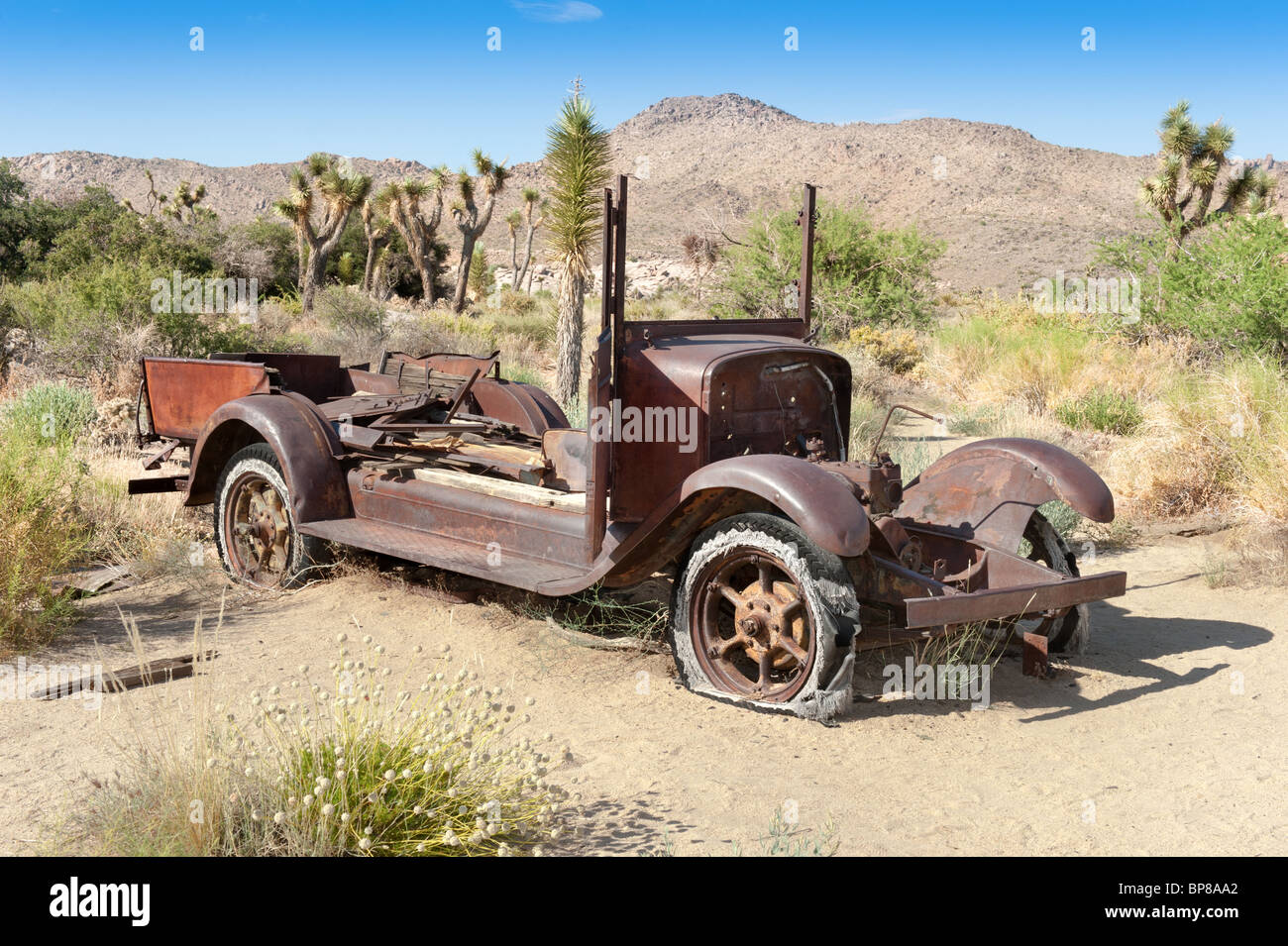 An old antique car left abandoned in the desert Stock Photo