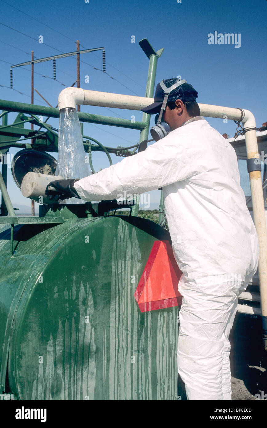 Agricultural worker wearing protective clothing Stock Photo Alamy