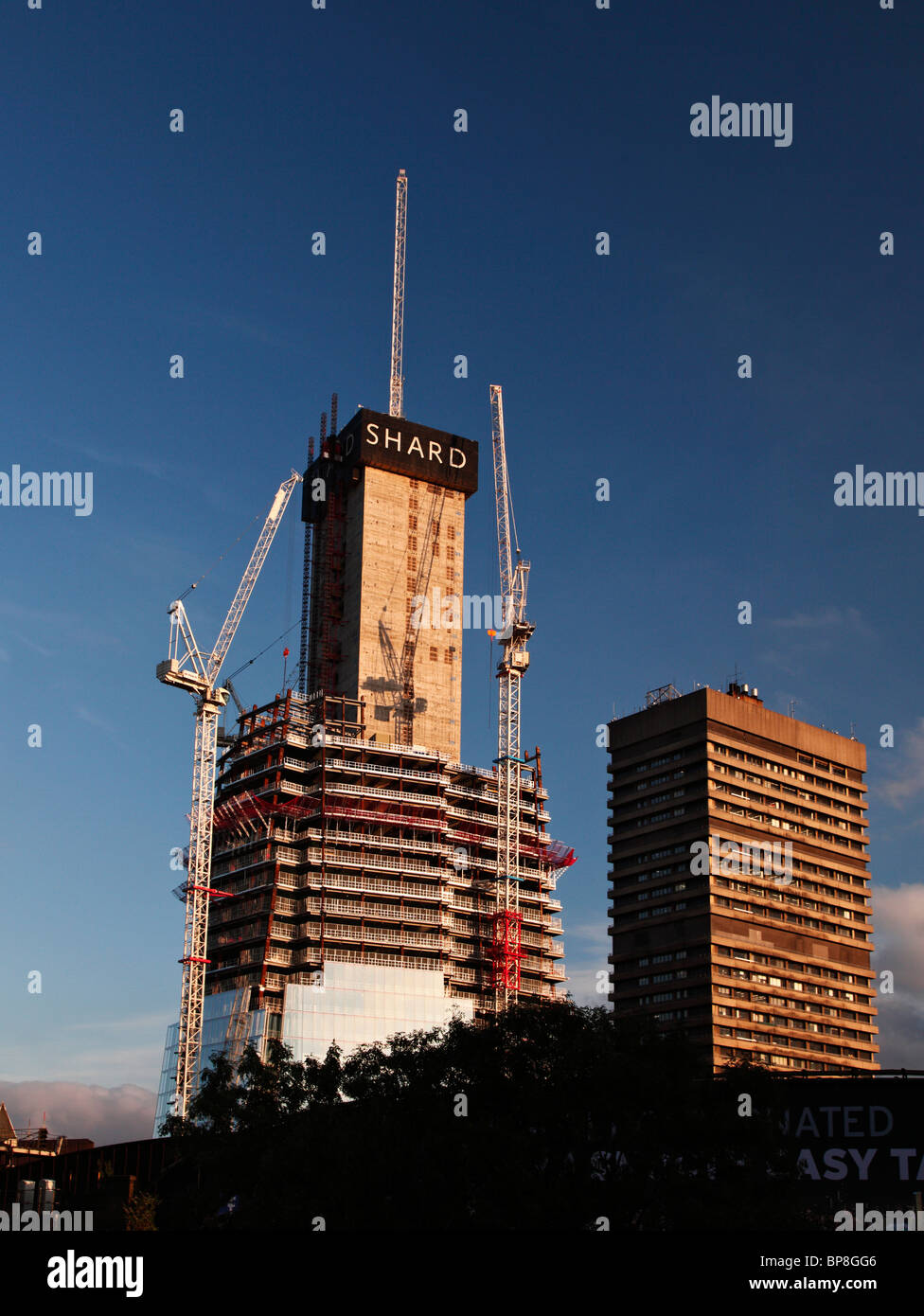 The Shard being constructed, next to Guys hospital. Stock Photo