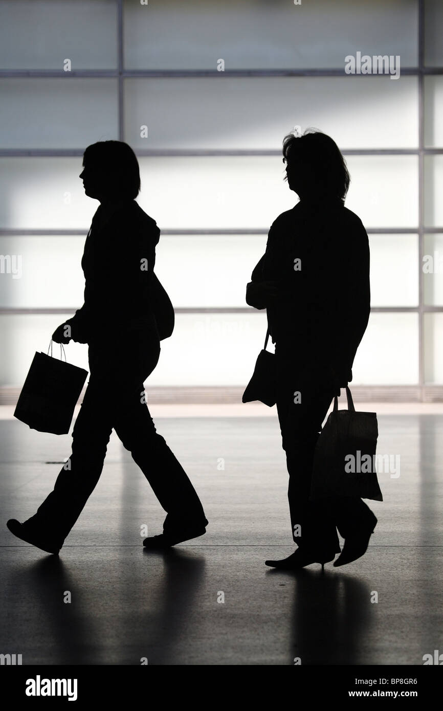 Silhouettes of two women Stock Photo - Alamy
