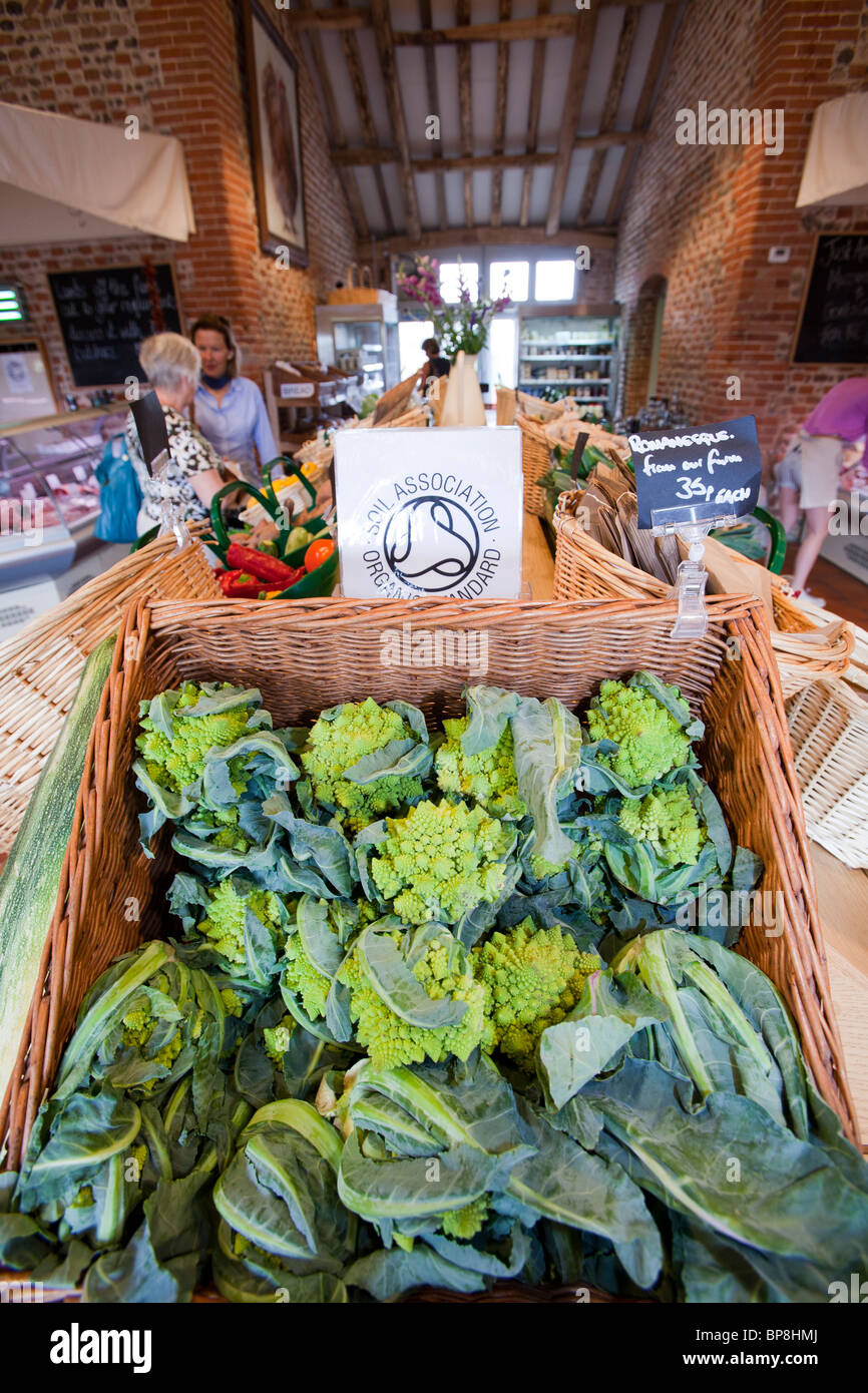 Home grown produce for sale at a farm shop in an old barn on a farm