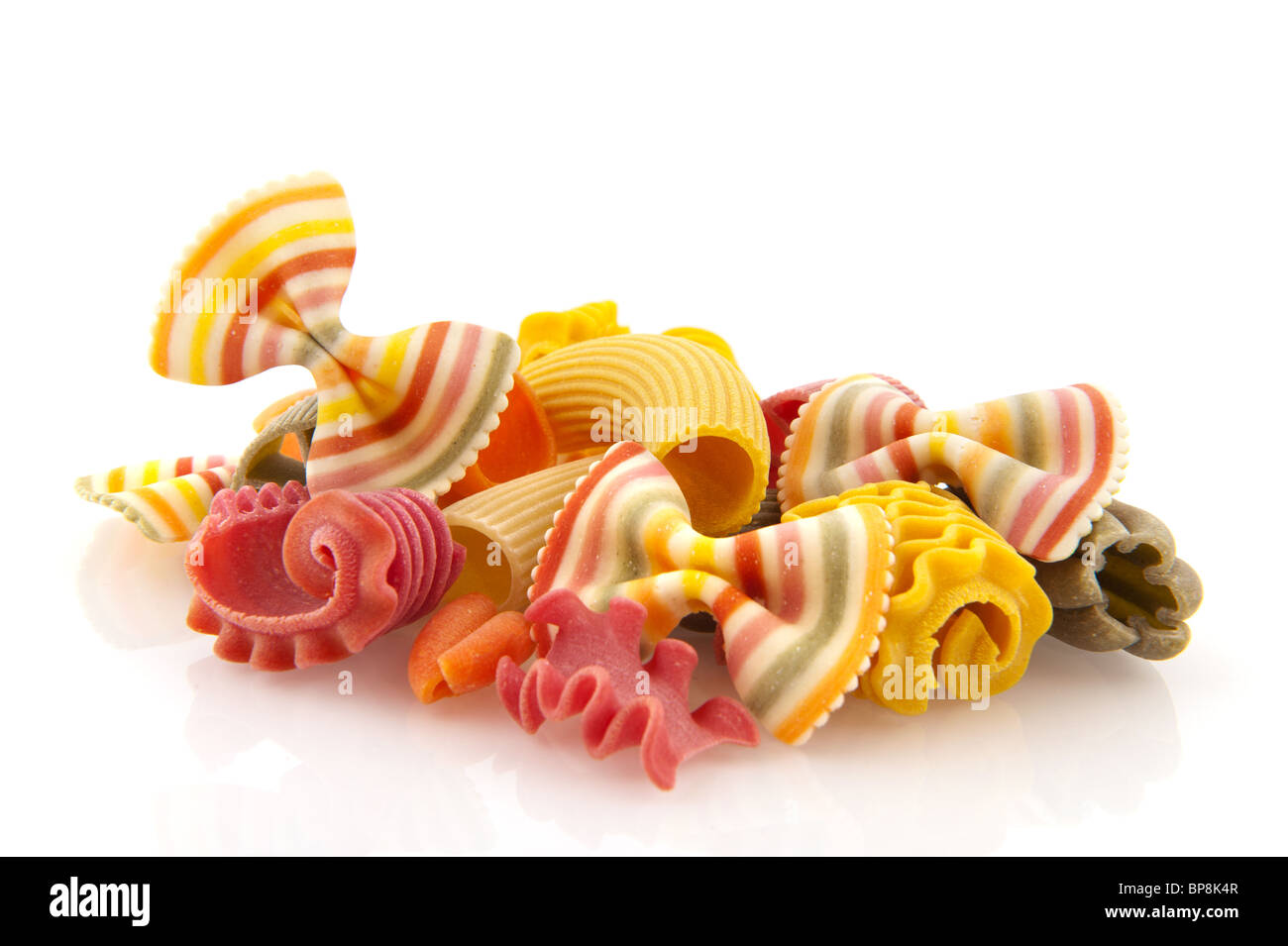 Colorful funny striped pasta isolated over white Stock Photo