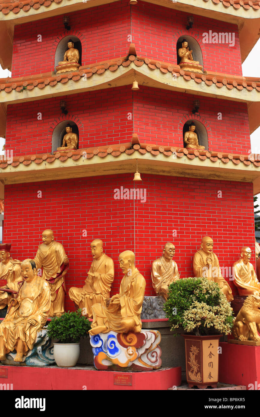 Buddha statues at the base of the pagoda at the Ten Thousand Buddha Monastery, Sha Tin, Hong Kong Stock Photo