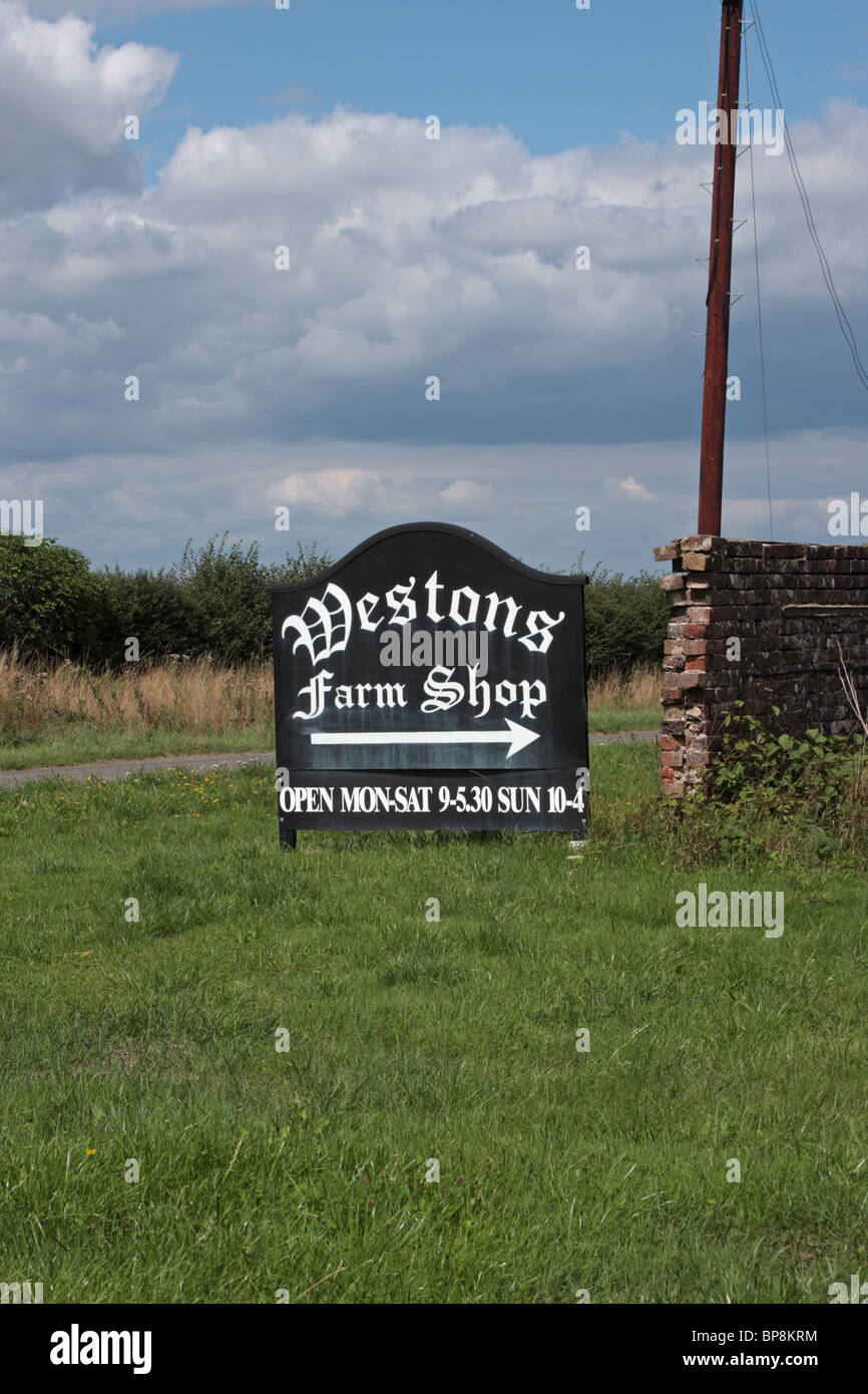 Sign showing entrance to Westons Farm Shop Itchingfield near Horsham West Sussex UK Stock Photo