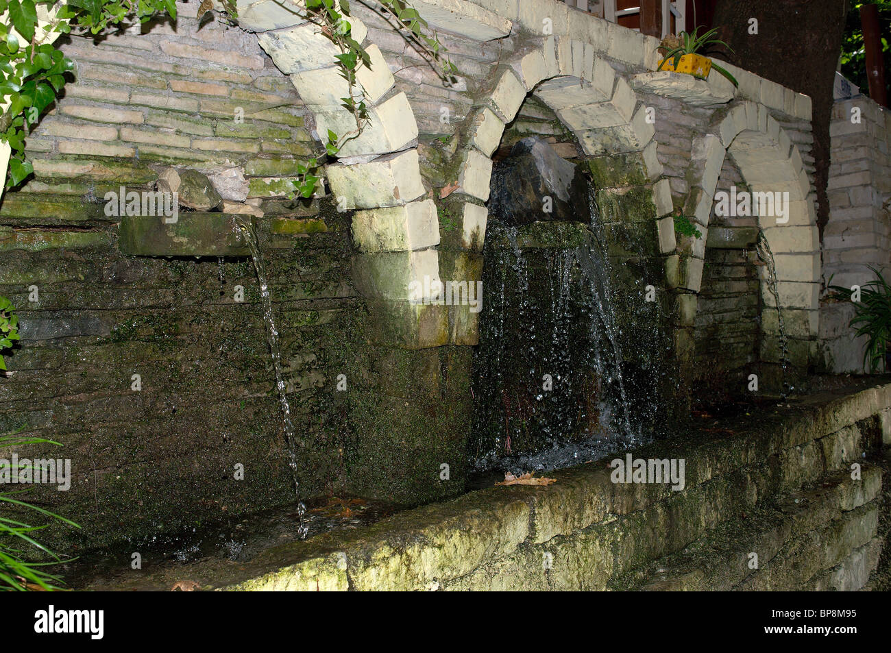 Stone arches with natural spring water Crete Greece Stock Photo - Alamy