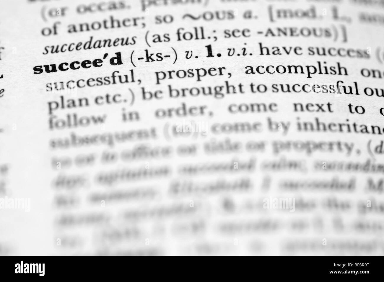The word succeed in an English dictionary Stock Photo