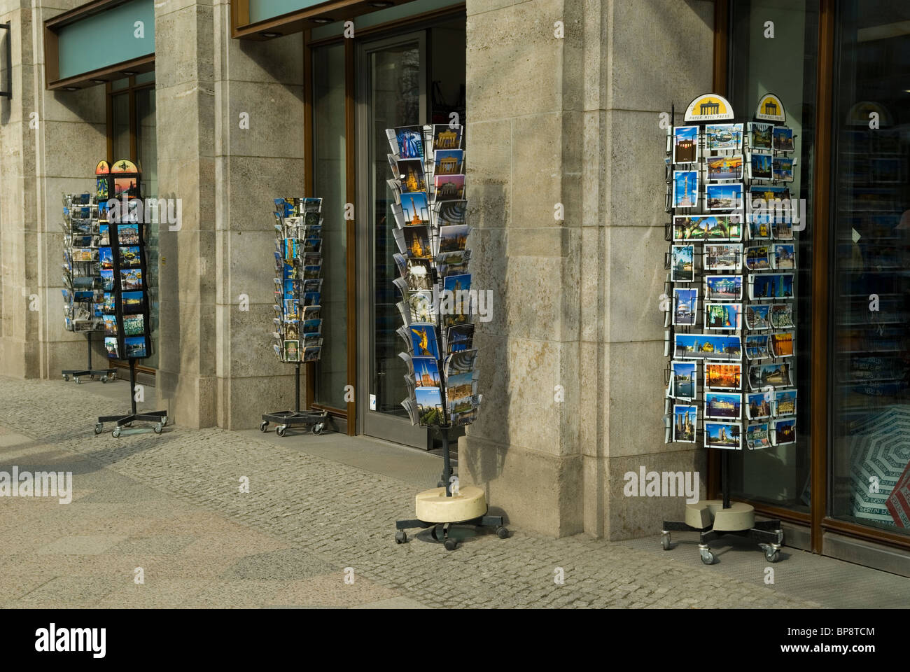 Postcard stands outside souvenir shop Berlin Germany Stock Photo