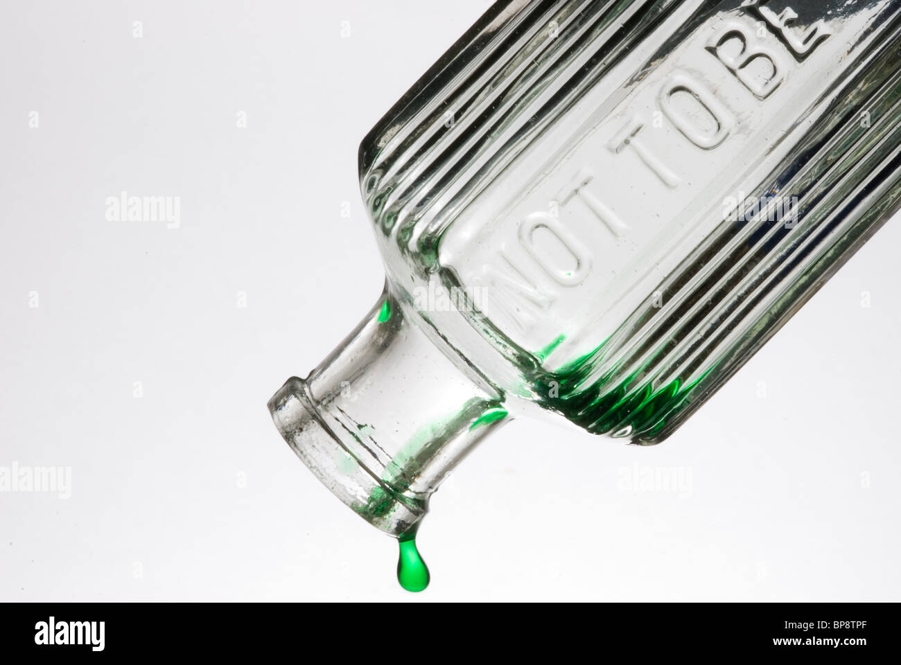 Bottle of green liquid - not to be taken. Stock Photo
