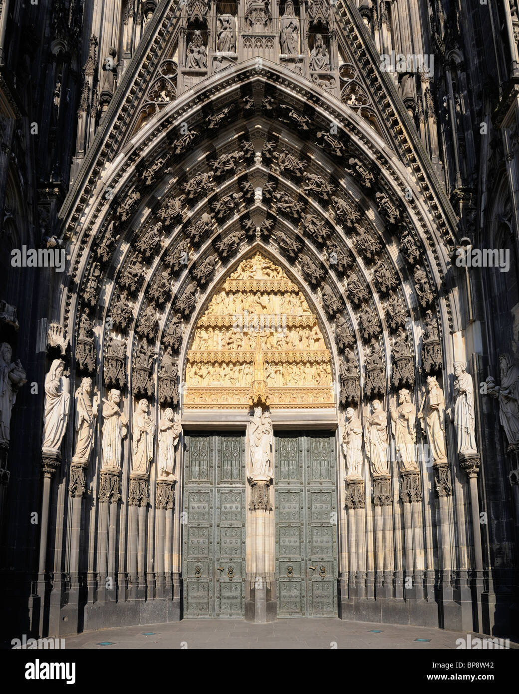 Cologne / Koln, Nordrhein-Westfalen, Germany. Cologne Cathedral / Kolner Dom. (1880) Front door detail Stock Photo