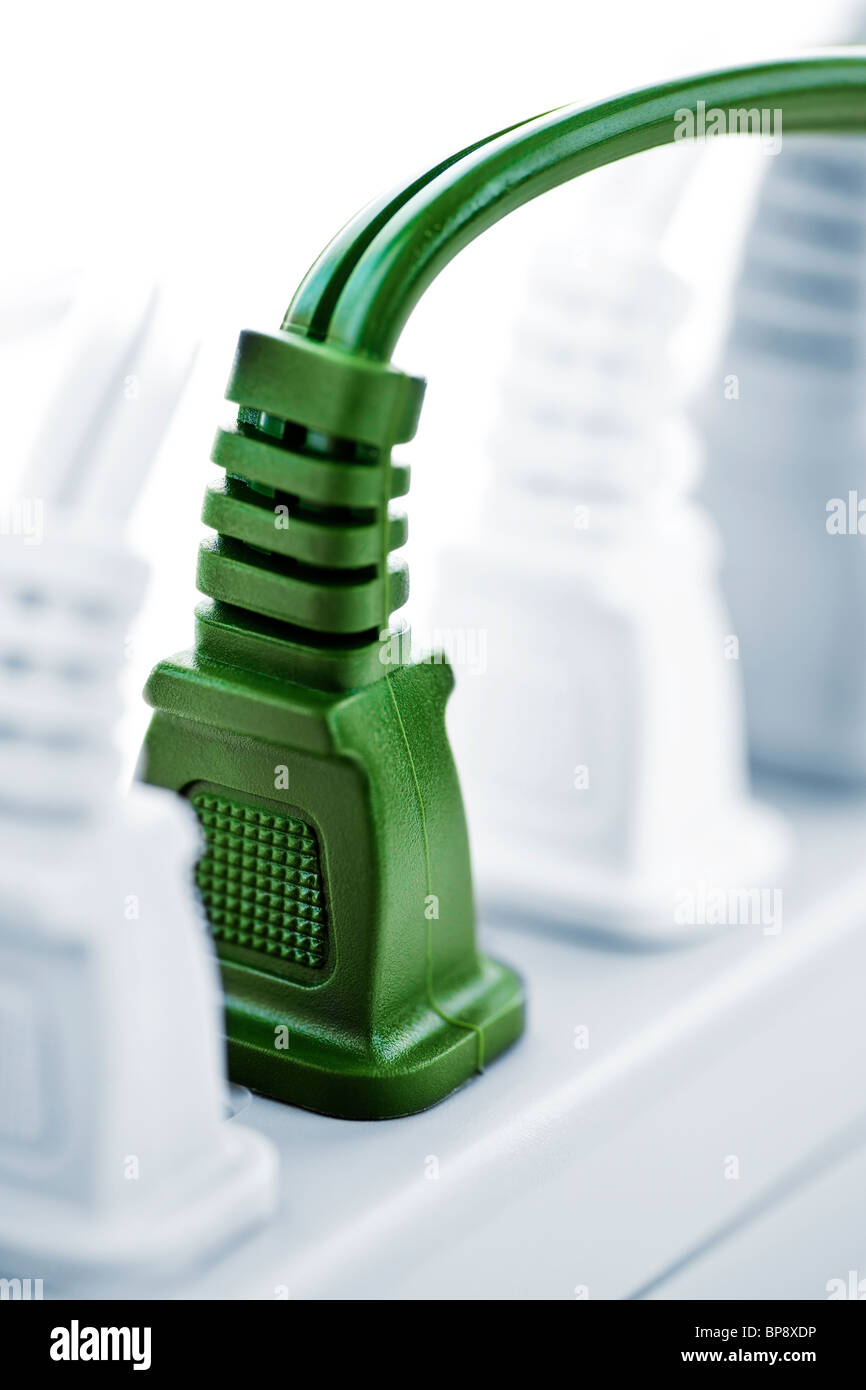 Many plugs plugged into electric power bar Stock Photo Alamy