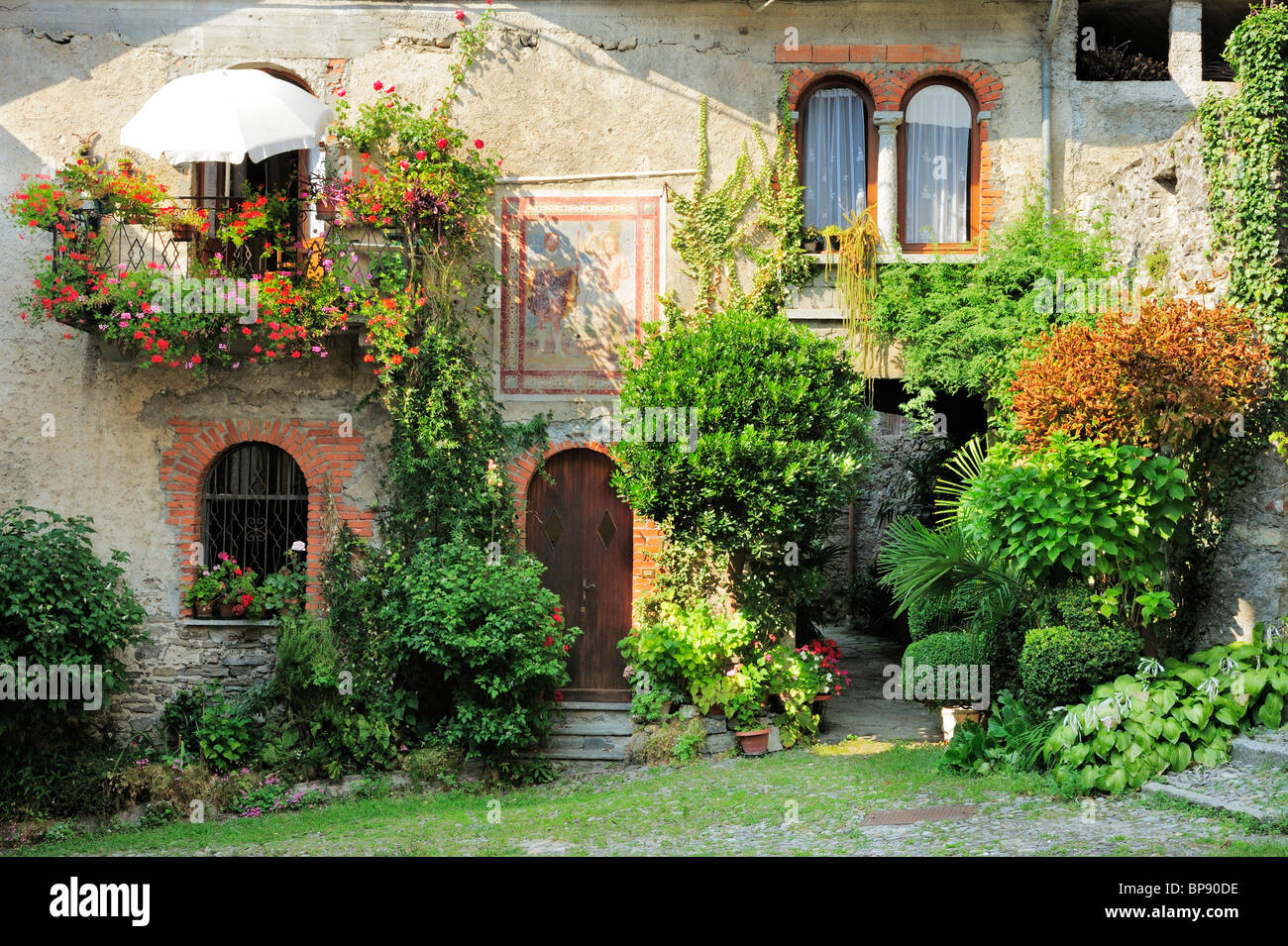 House with frescos and floral decoration, Barna, Monti Lariani, Lake Como, Lombardy, Italy Stock Photo