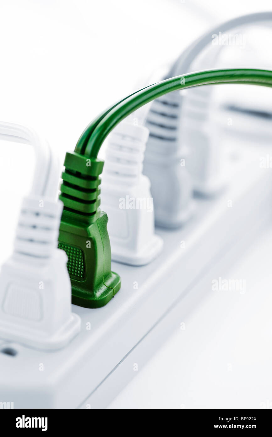 Many plugs plugged into electric power bar Stock Photo Alamy
