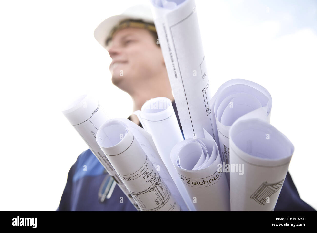 Construction worker with plans, Munich, Bavaria, Germany Stock Photo ...
