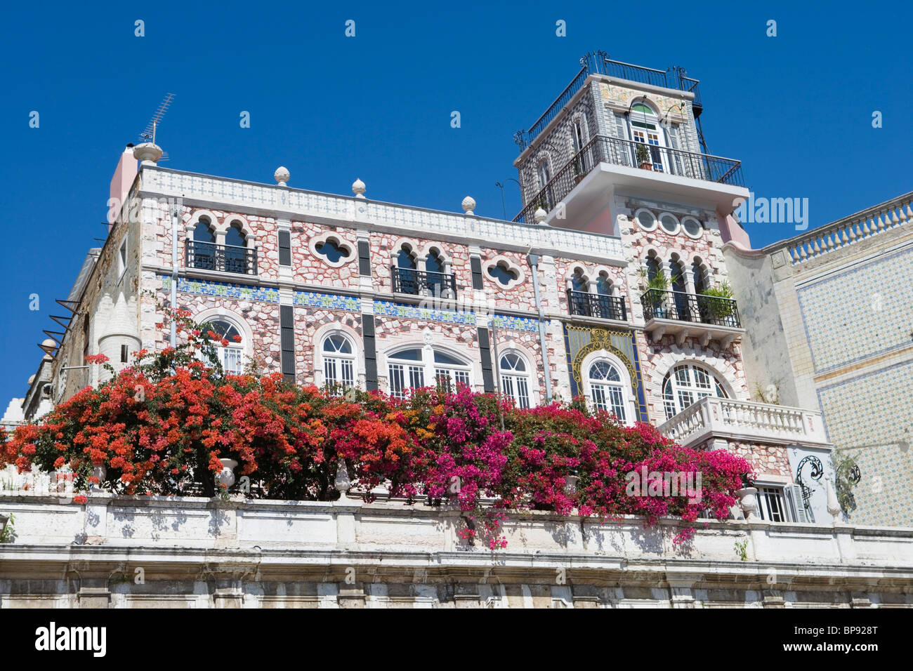 Bougainvillea on the balcony of a building in the Alfama District ...