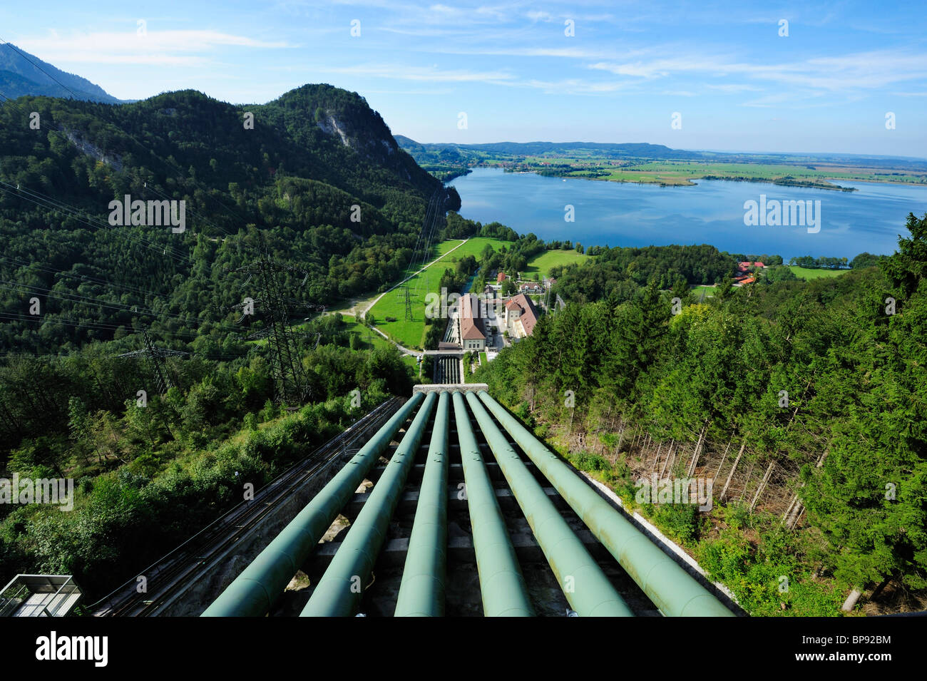 Down pipe of hydropower station lake Walchensee and pylons, lake Kochelsee in background, Bavarian Alps, Upper Bavaria, Bavaria, Stock Photo