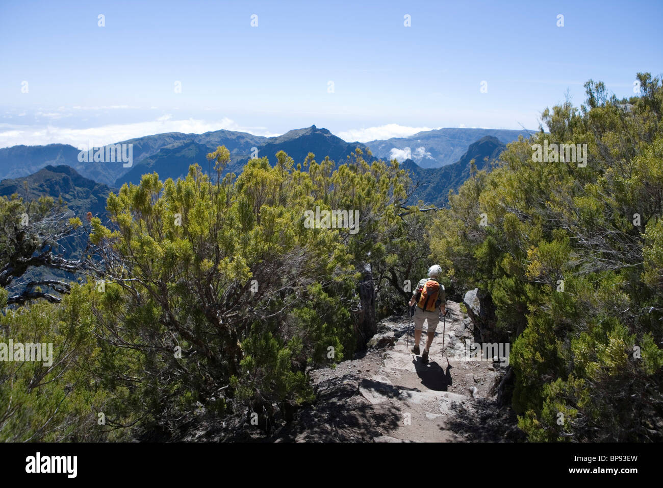 Hiker descending from the summit of Pico Ruivo Mountain, Pico Ruivo, Madeira, Portugal Stock Photo