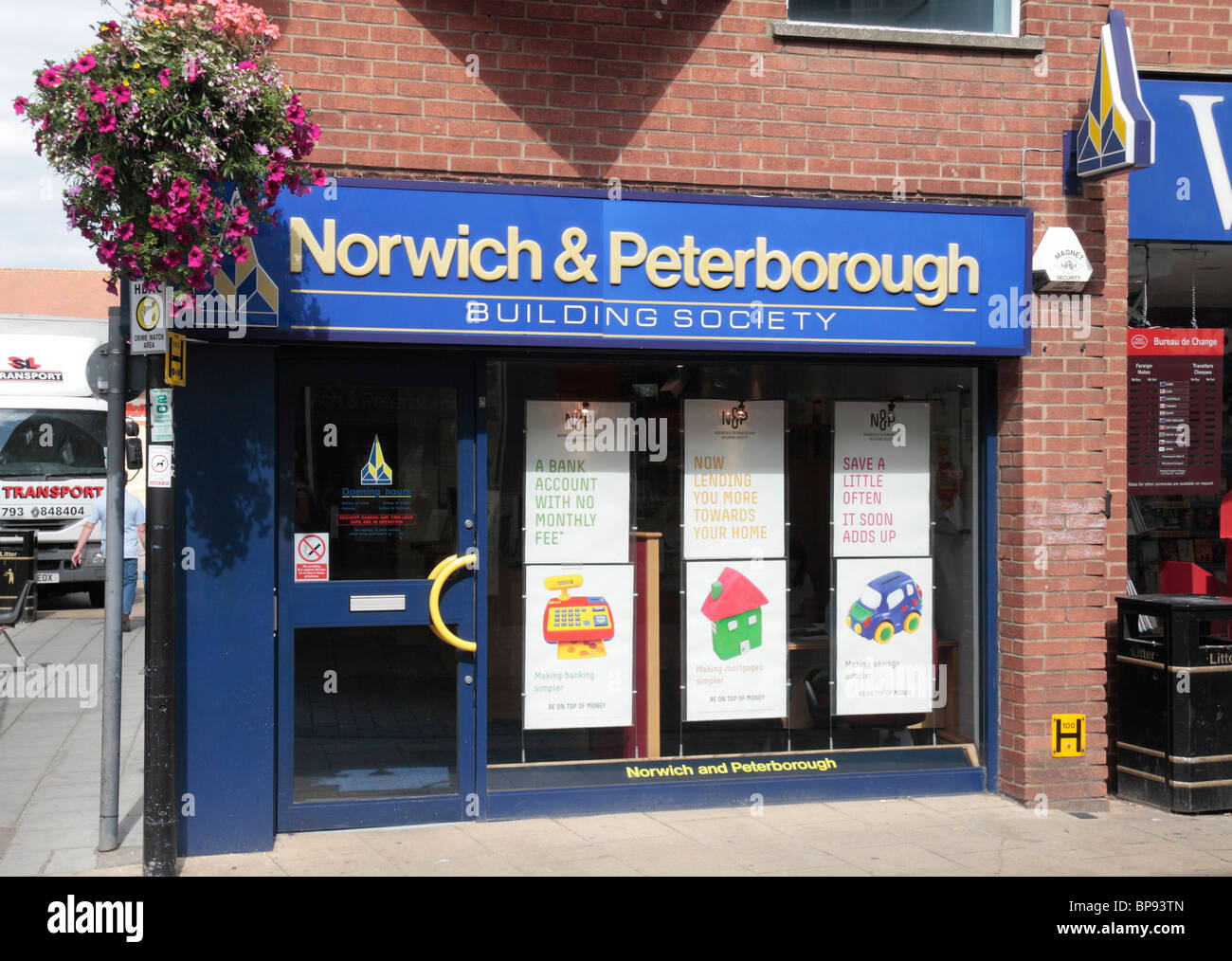 The logo and shop front of a branch of the Norwich and Peterborough Building Society, in Huntingdon, UK. Stock Photo