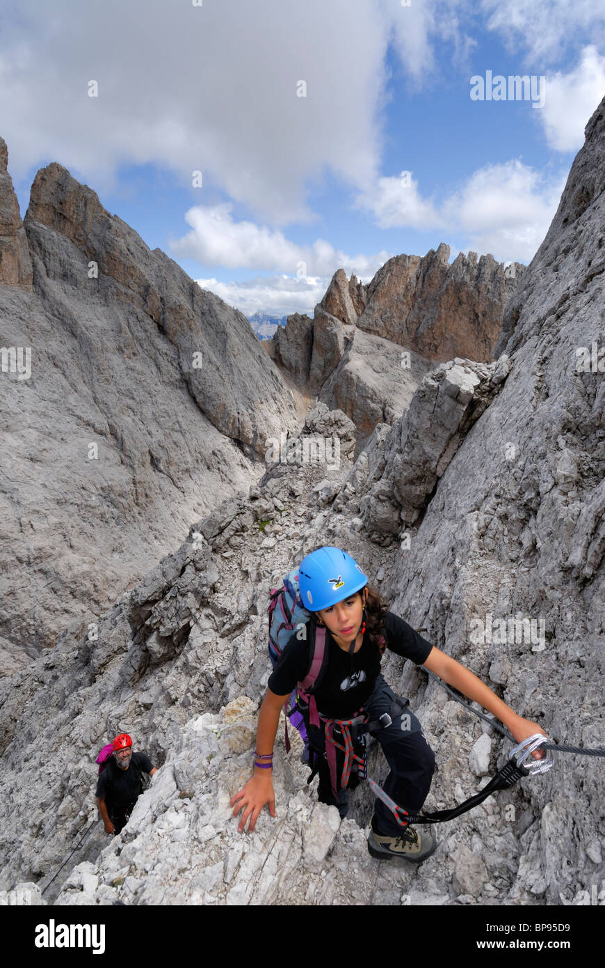 Girl climbing at Sass Rigais, Geisler range, Dolomites, Trentino-Alto Adige/South Tyrol, Italy Stock Photo
