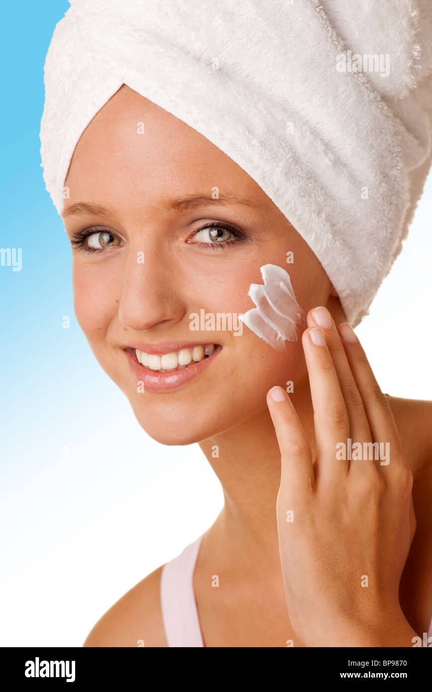 woman applying face cream Stock Photo Alamy