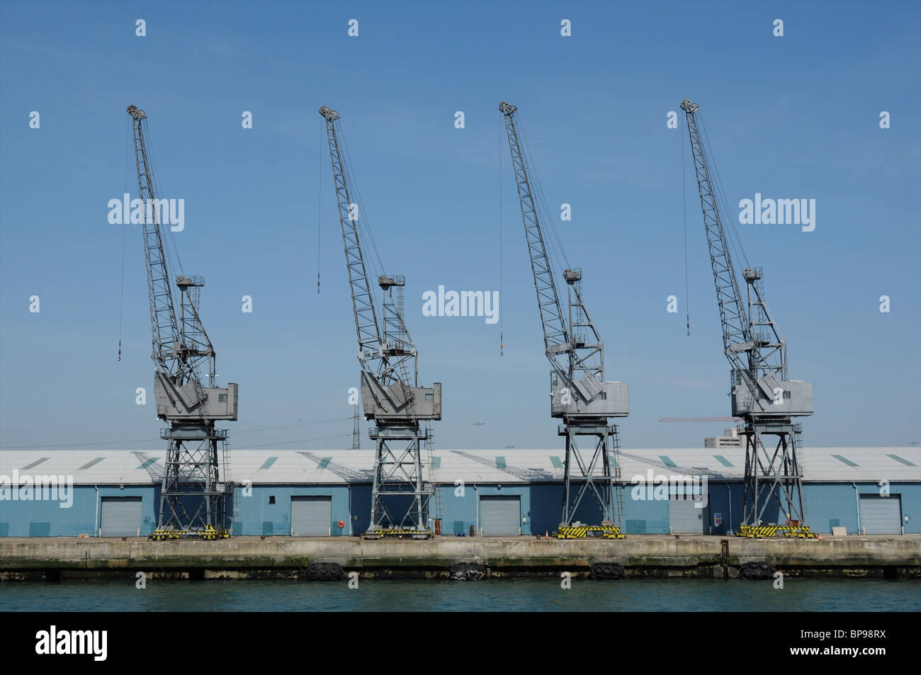 A row of dockside cranes at Southampton Docks, Hampshire, England, UK Stock Photo