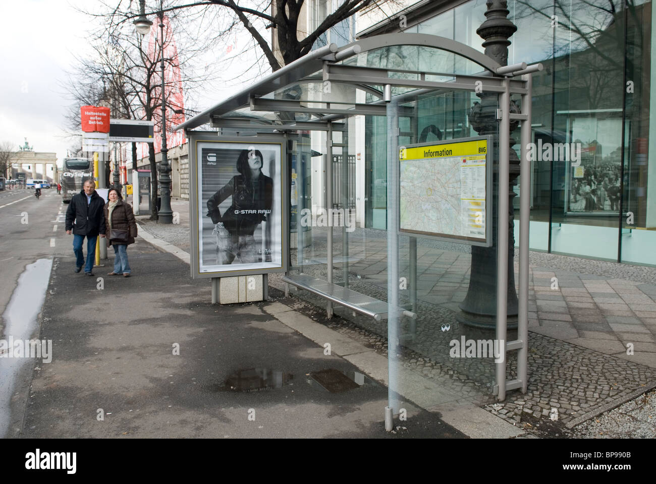 People by bus stop on  Brandenburg Gate Berlin City Germany Europe Stock Photo
