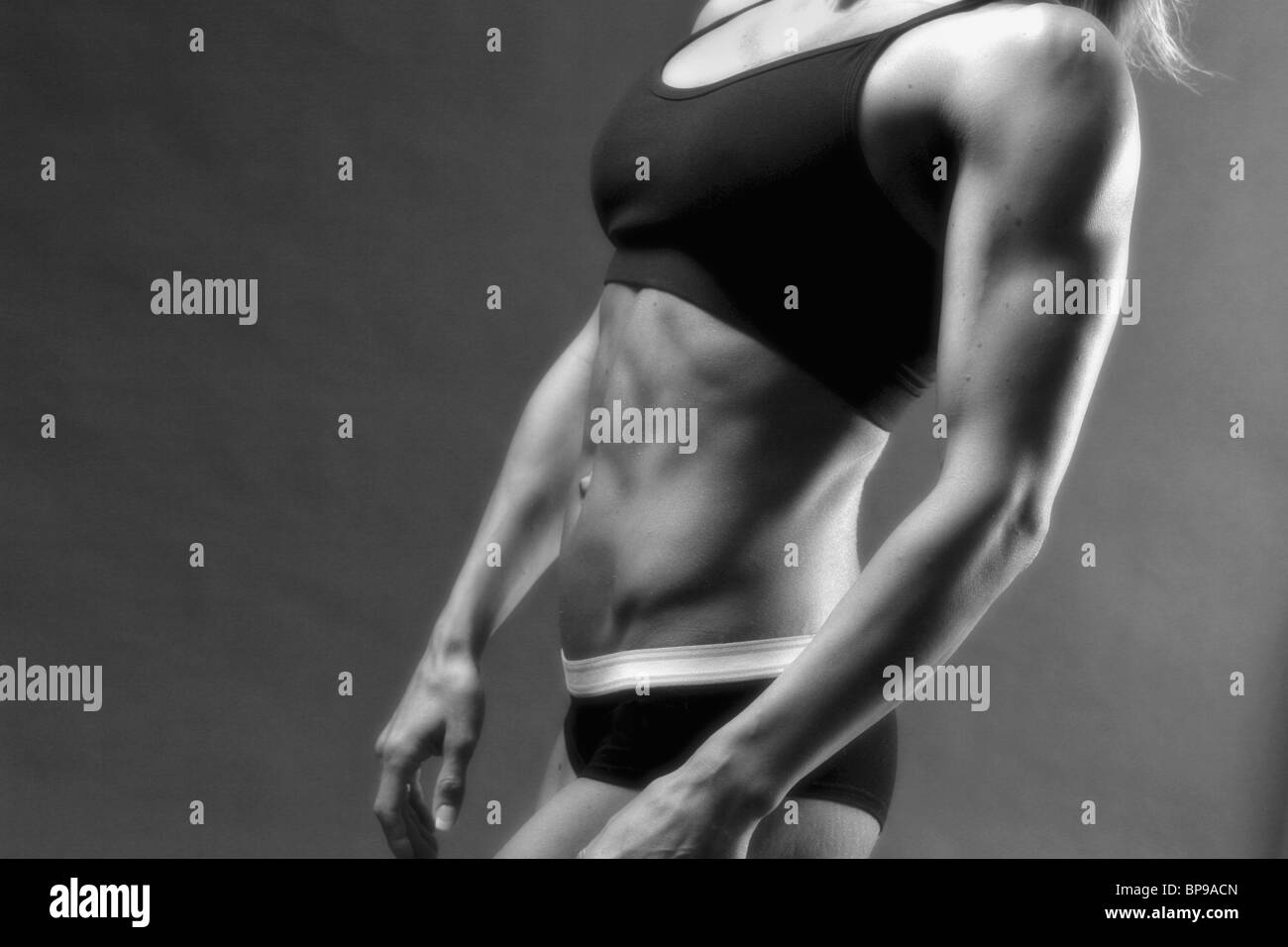 A Women's Muscular Body Stock Photo