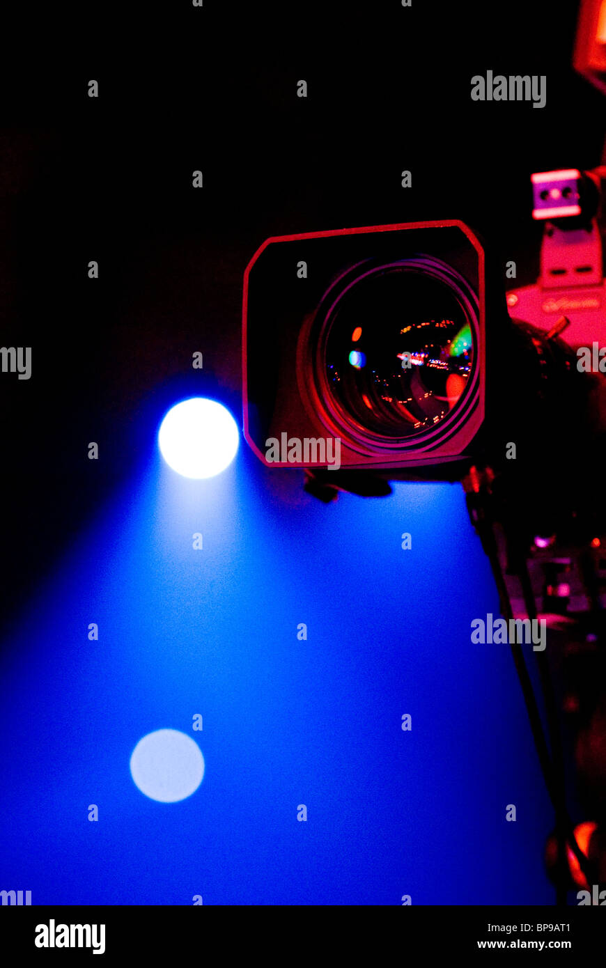 Video camera lens and stage lights Stock Photo Alamy