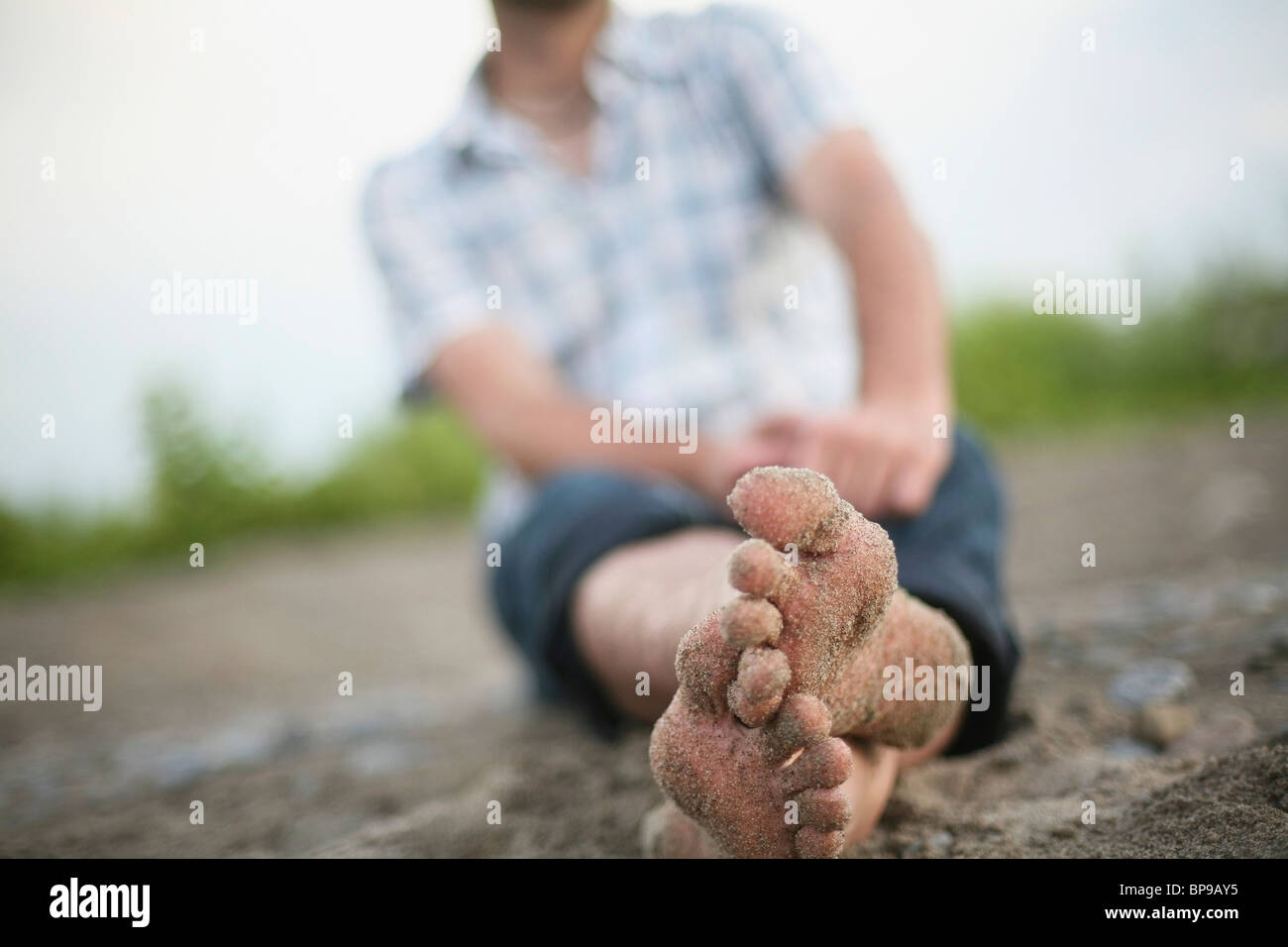 Stoney Creek, Ontario, Canada; Bare Feet Covered In Sand Stock Photo