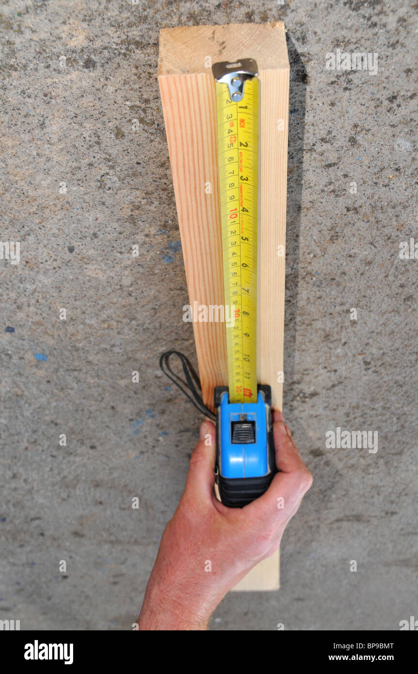 Measuring block wood using measuring hires stock photography and
