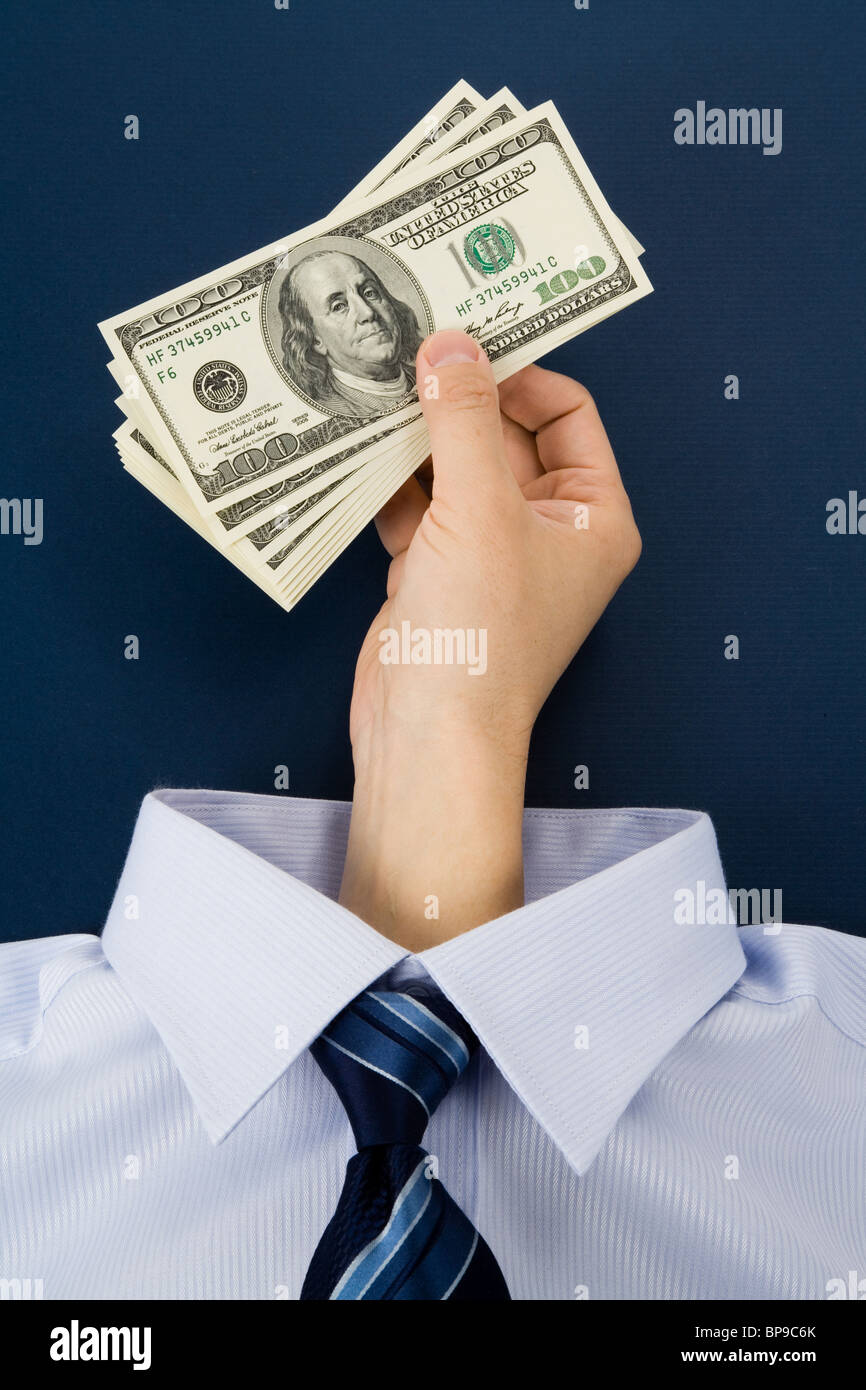 Shirt and hand holding Dollar, Business Concept Stock Photo