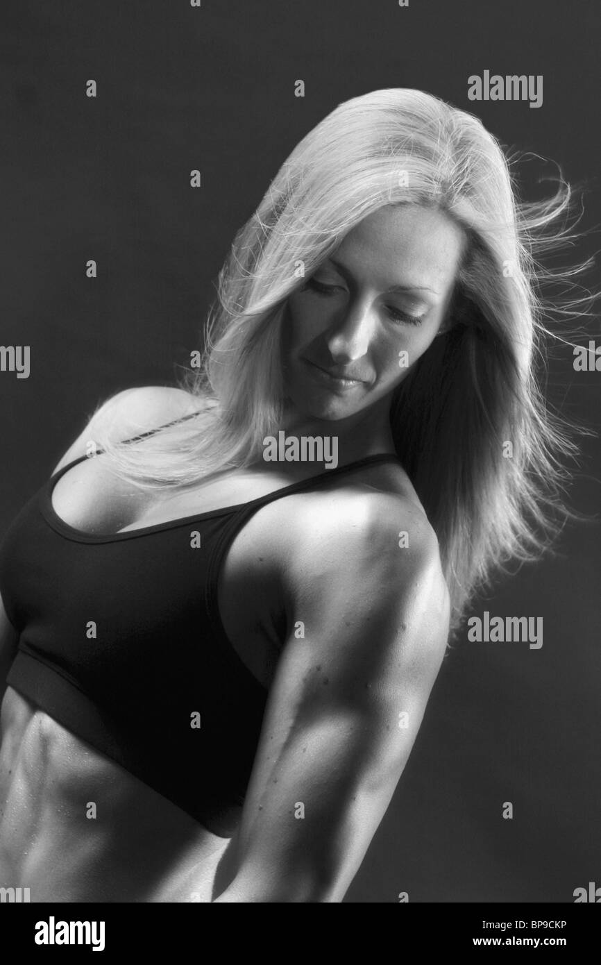 A Woman's Muscular Body Stock Photo