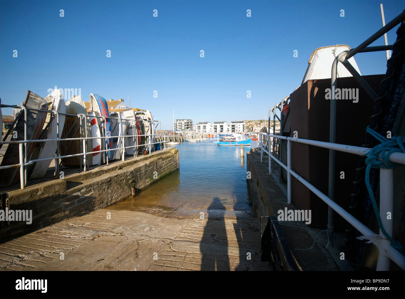West Bay Dorset UK Harbor Harbour Quay Fishing Boats Dingies Park Stock ...
