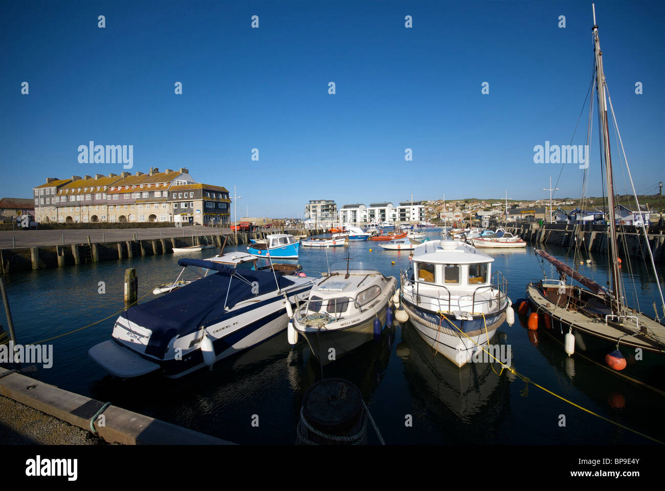 West Bay Dorset UK Harbor Harbour Quay Fishing Boats Stock Photo - Alamy