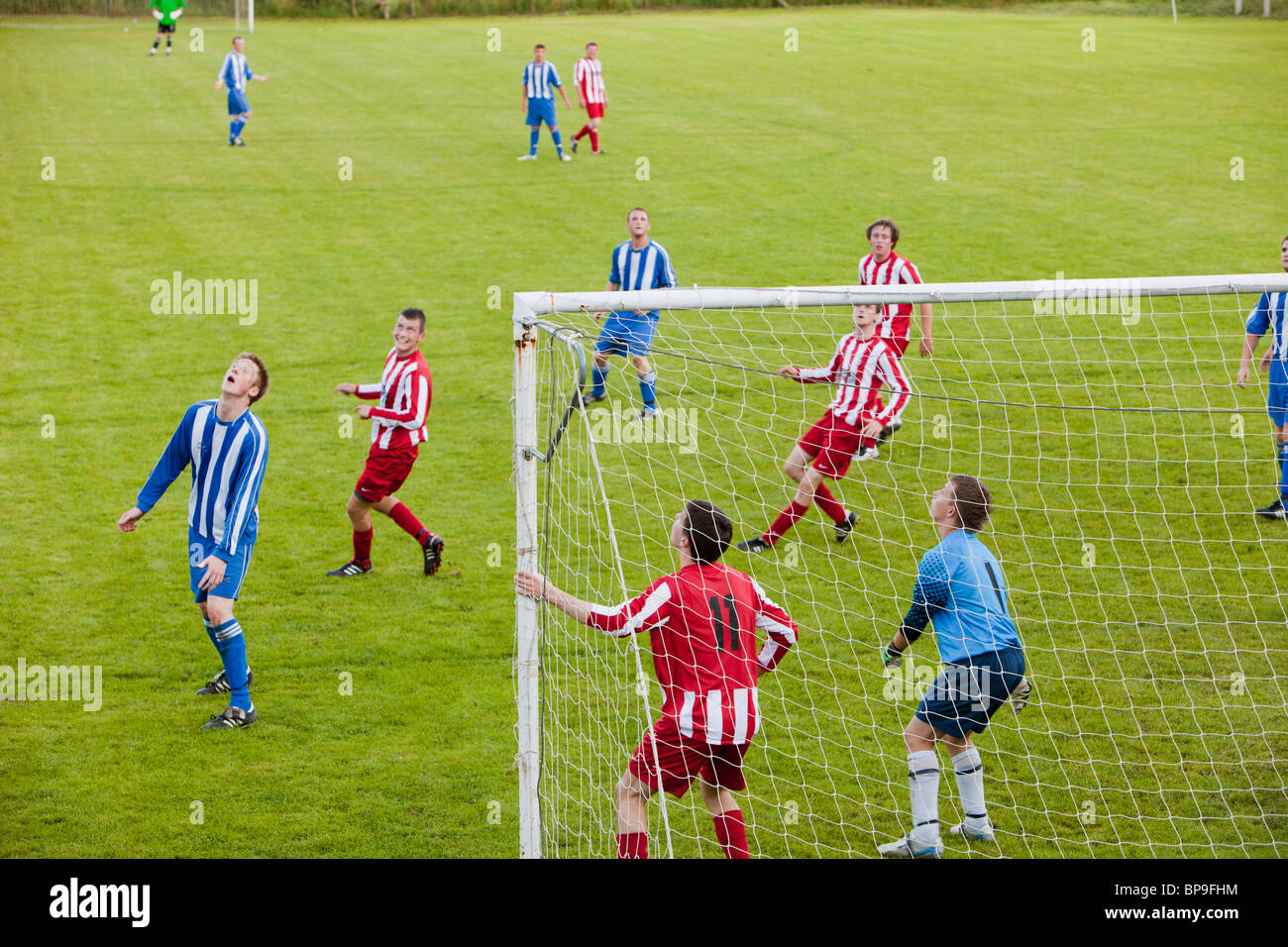 Ambleside FC playing Ulverston Town football club at Ambleside's football pitch, Lake District, UK. Stock Photo