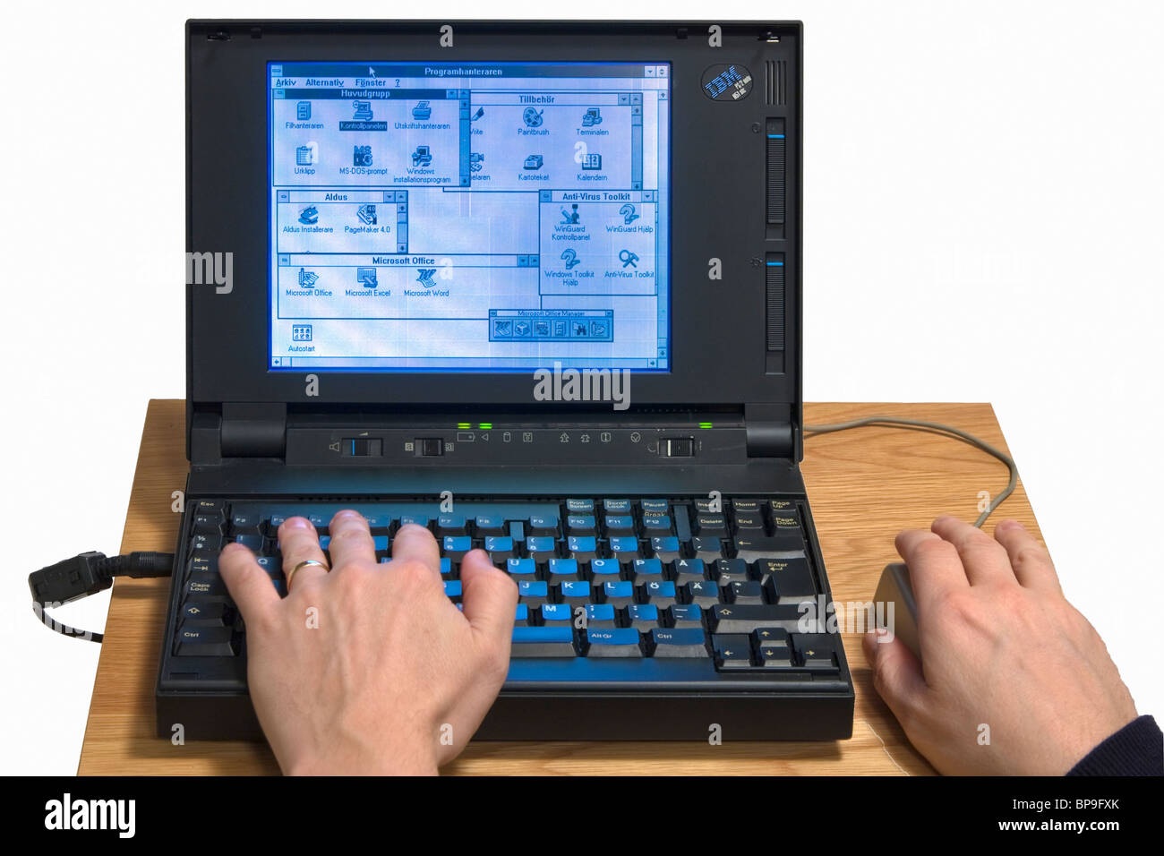 Old IBM PS/2 thinkpad running Windows 3.1, an old 16 bit operating system that needed another operiting system, DOS, to operate. Stock Photo