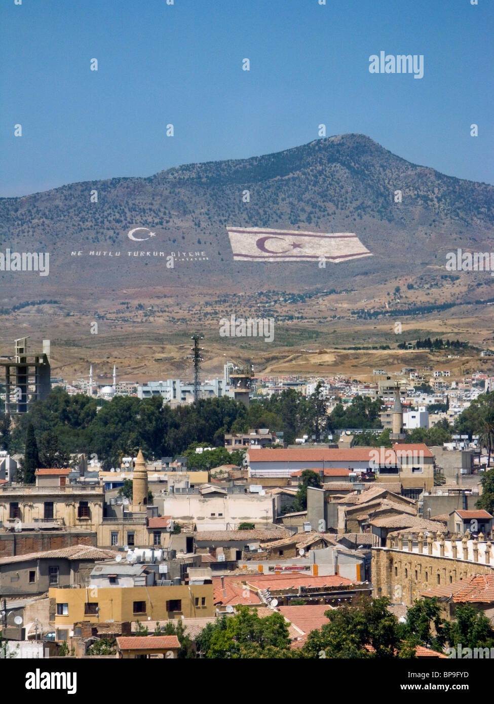 Turkish flag and the flag of the Turkish Republic of Northern Cyprus painted on the Kyrenia moountins above Nicosia (Lefkosia). Stock Photo