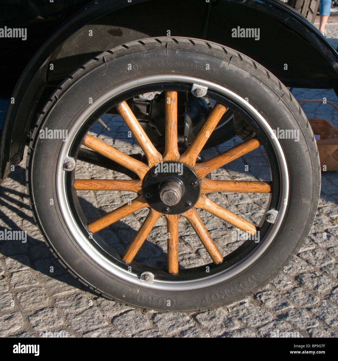 Wooden spookes on the wheel of an old car. Stock Photo