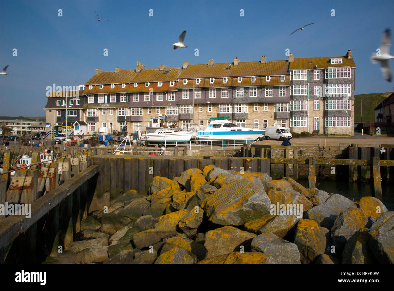 West Bay Dorset UK Harbor Harbour Quay Fishing Boats Stock Photo - Alamy