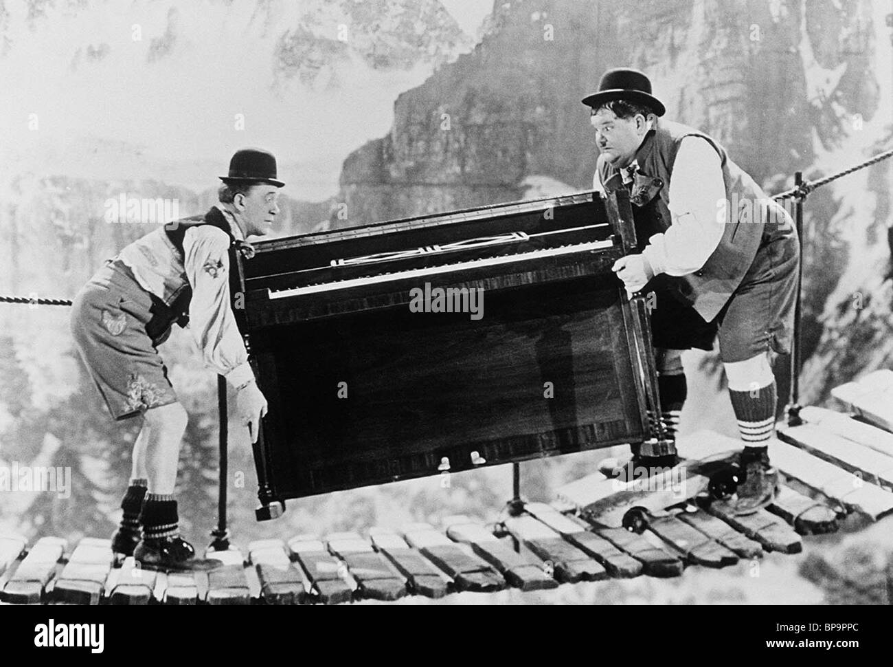 STAN LAUREL, OLIVER HARDY CARRY PIANO OVER MOUNTAIN, SWISS MISS, 1938 Stock  Photo - Alamy