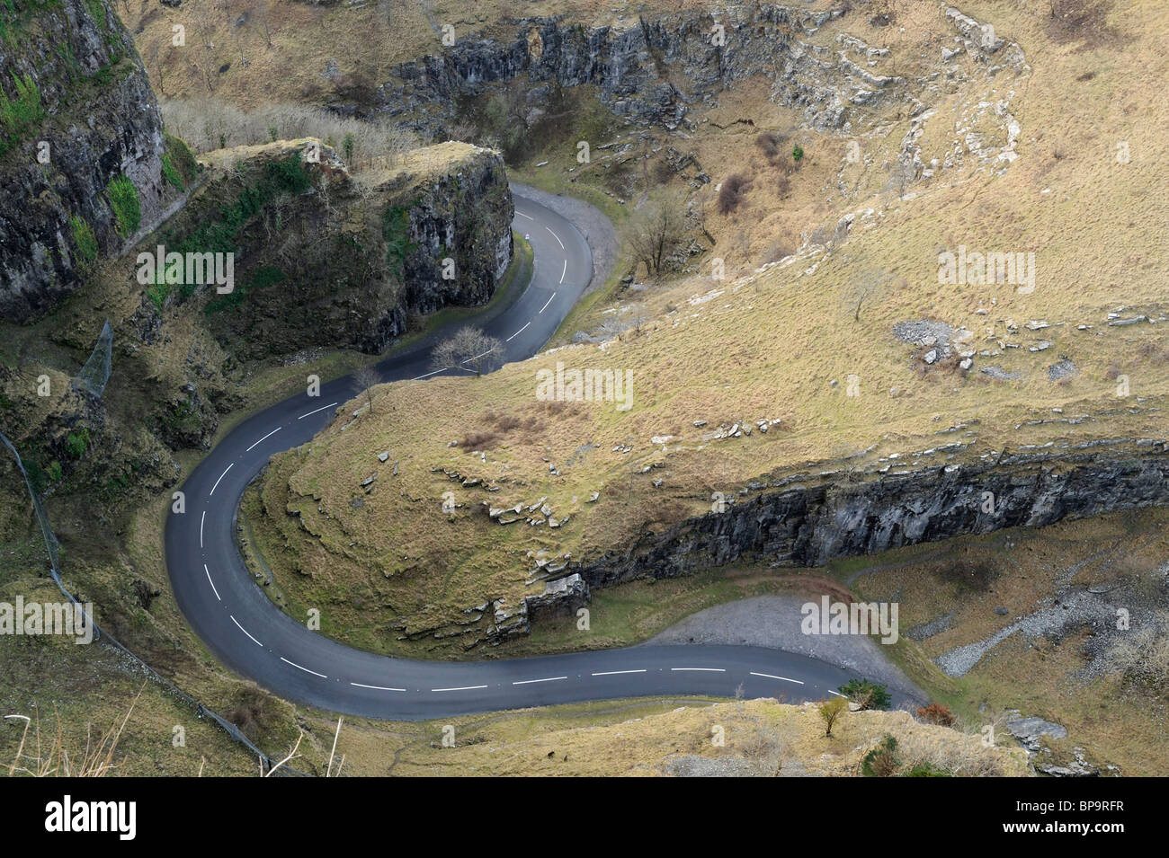 A snaking road winding through Cheddar Gorge, Somerset, seen overhead from the top of the gorge. Stock Photo