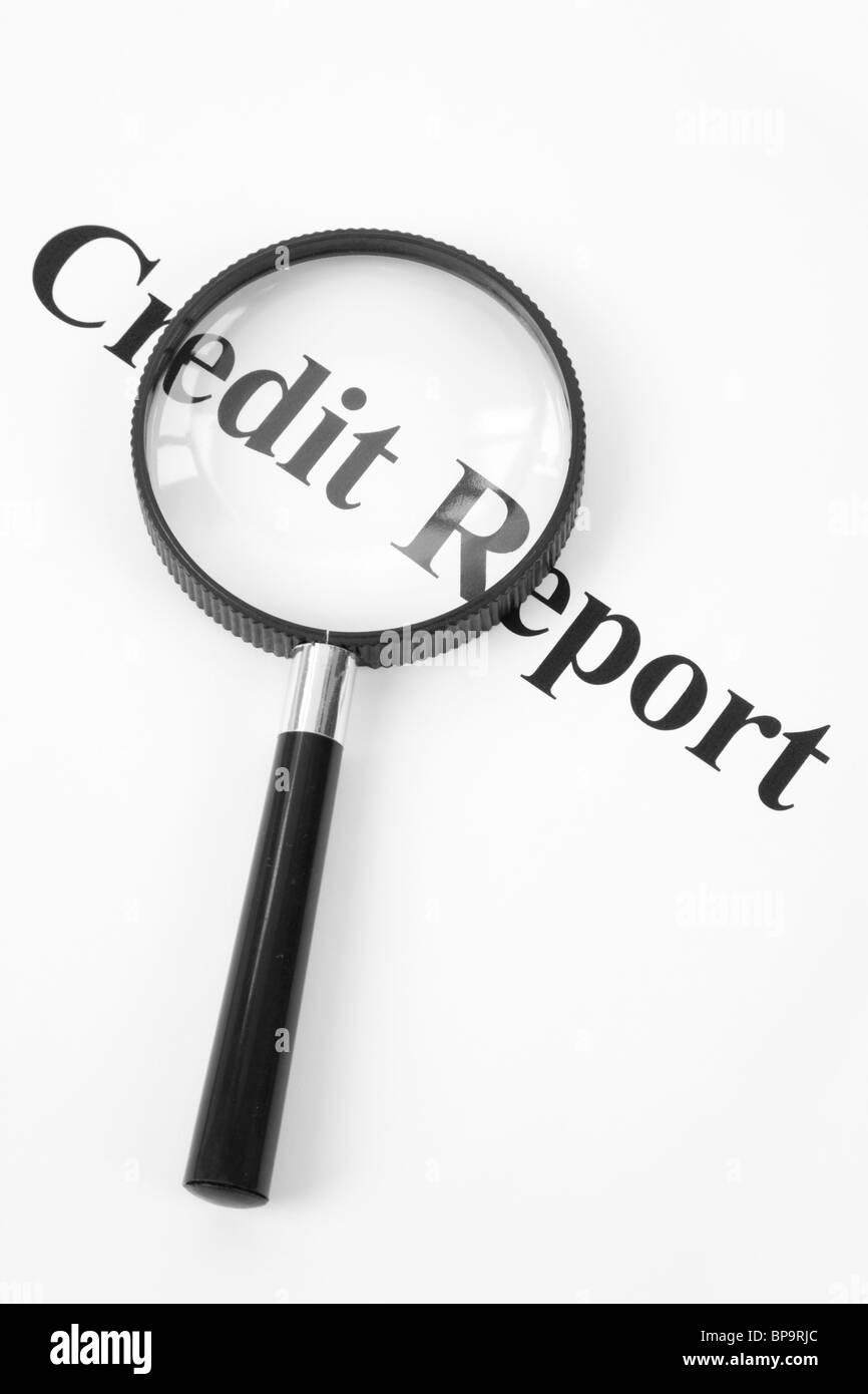 Credit Report and Magnifying Glass Stock Photo
